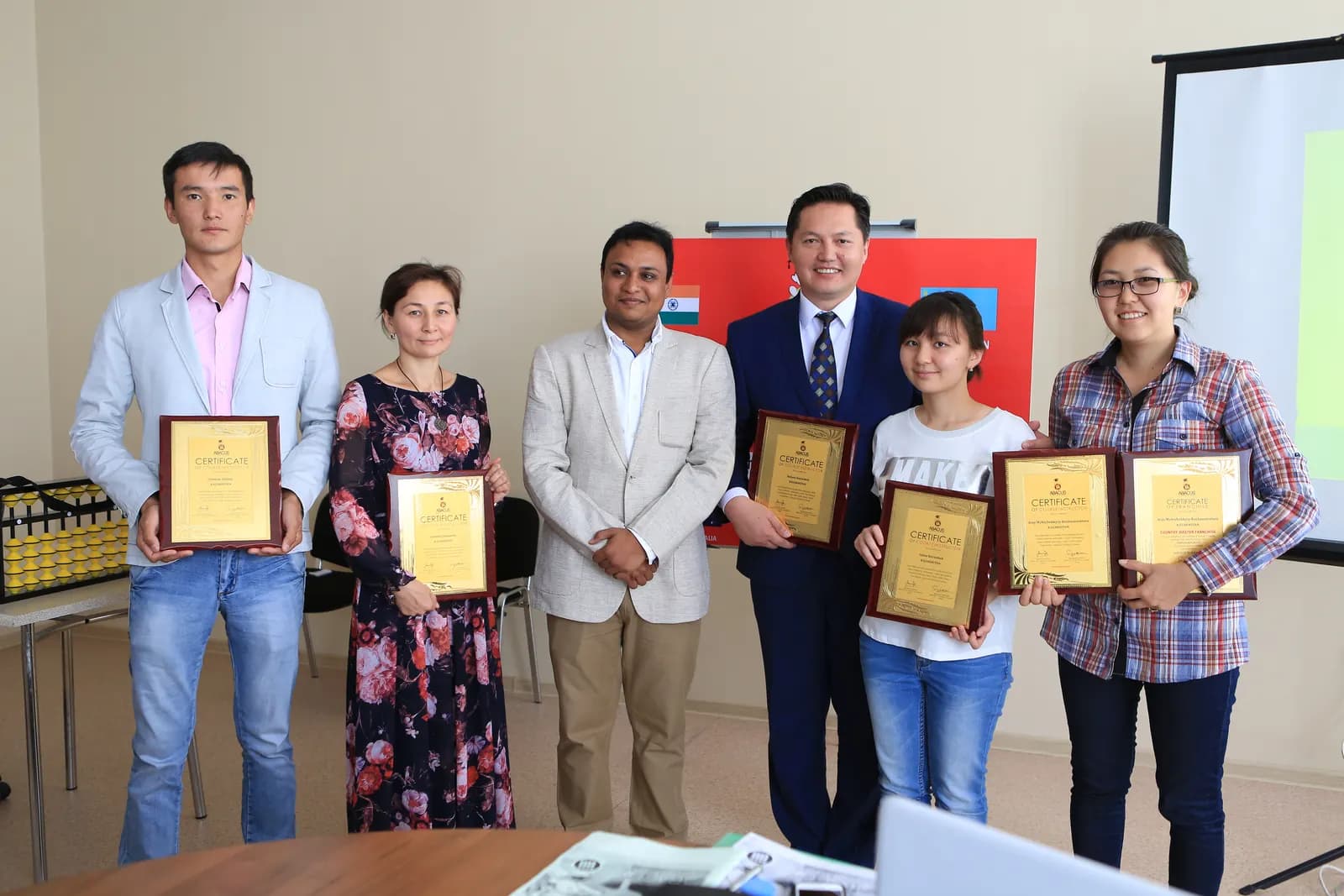 Academy participants receiving certificates of achievement