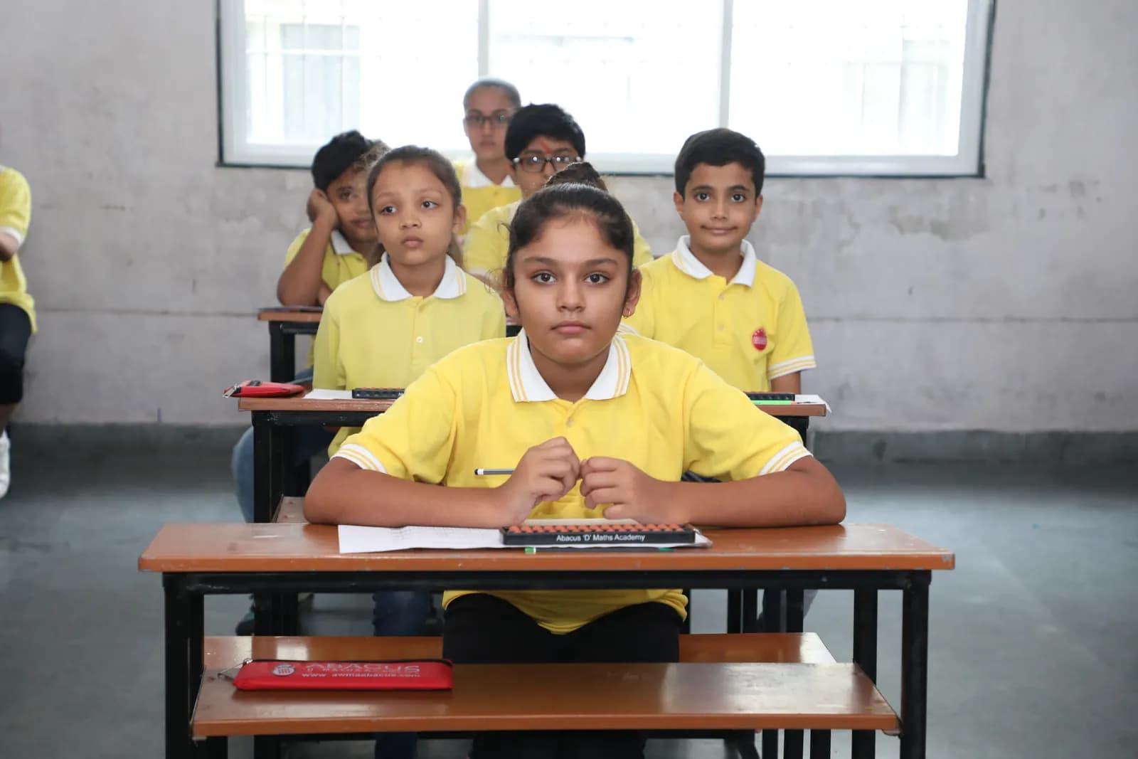 Children practising mental maths with Abacuses in a classroom