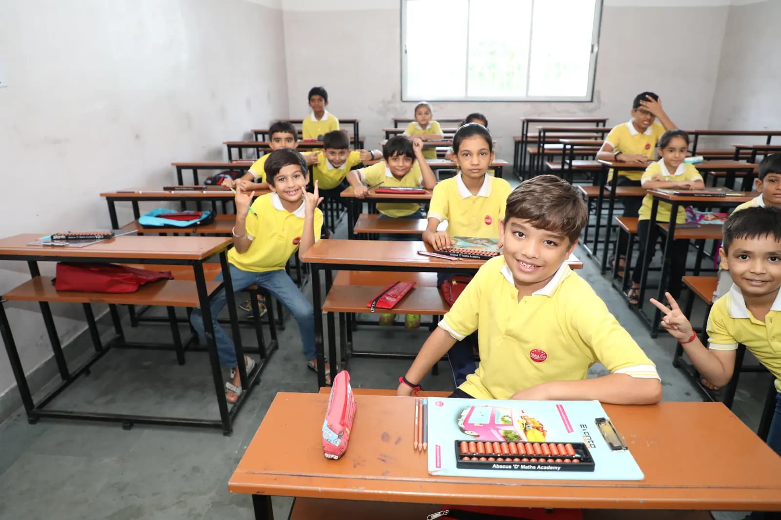 Students practising with abacuses in classroom