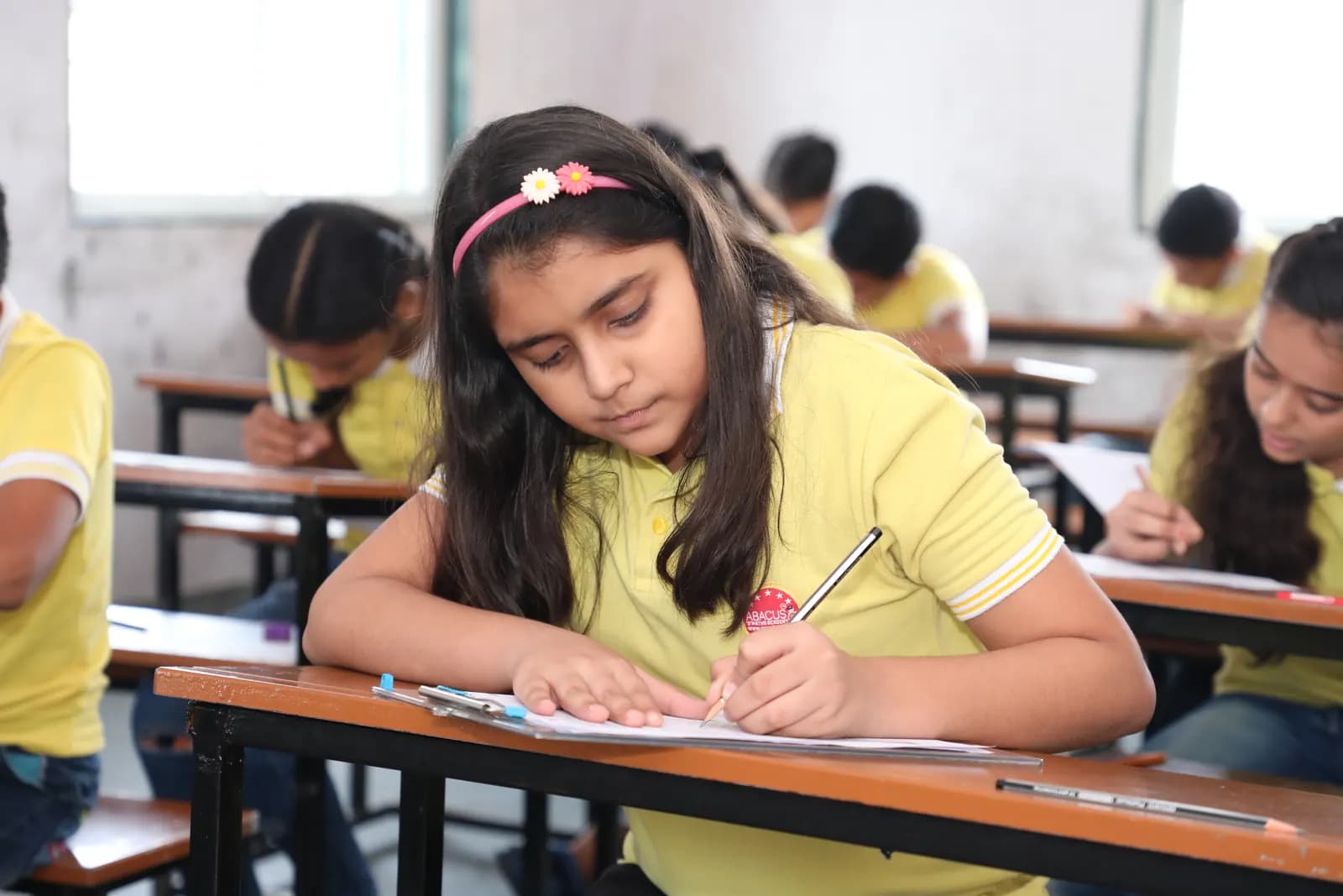 Student concentrating during abacus practice session